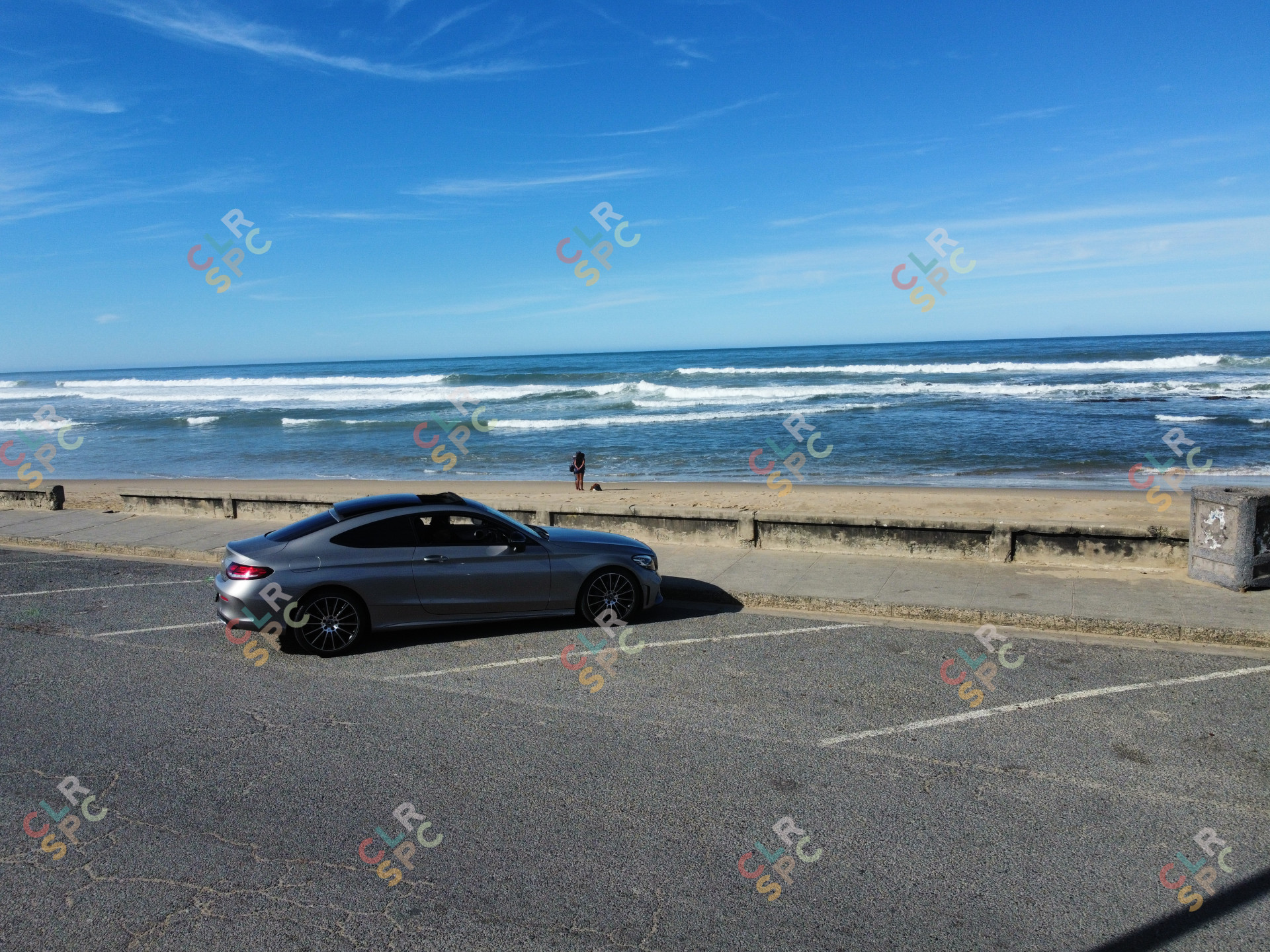 Mercedes Benz C200 in front of the beach
