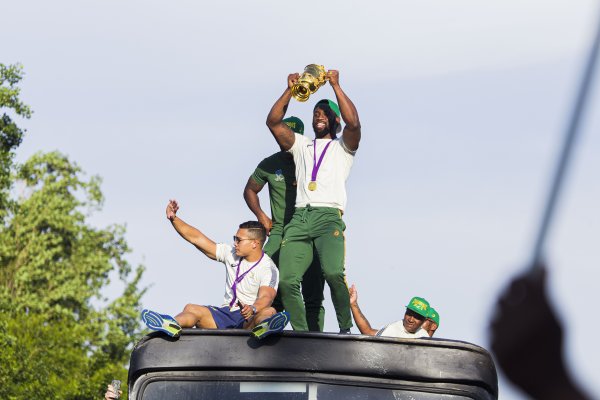 Siya Kholisi holding the Rugby World Cup trophy