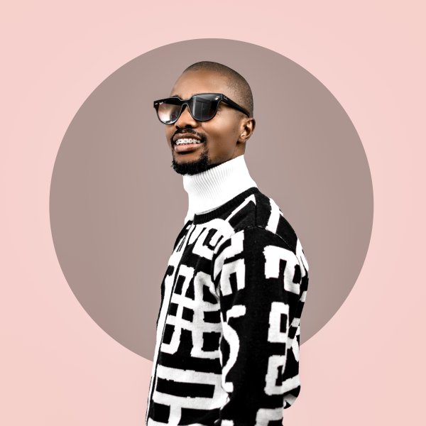 Black man wearing glasses in a studio