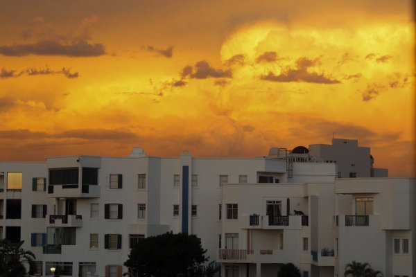 Sunset over white building