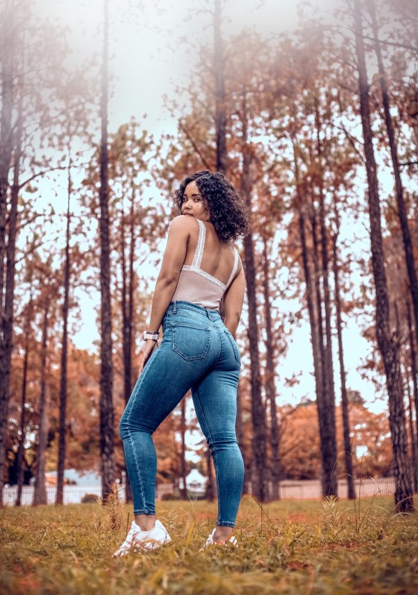 Black woman in a pine forest