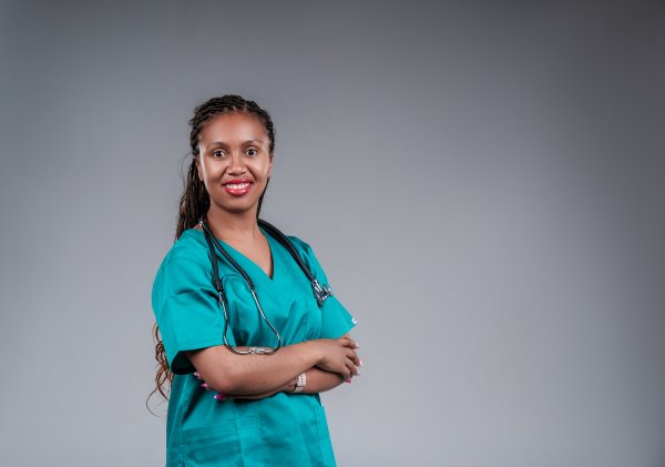 Young African female doctor posting confidently wearing stethoscope.